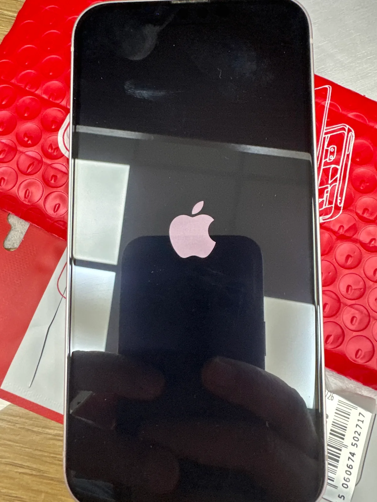 A customer's iPhone powering on following a screen repair